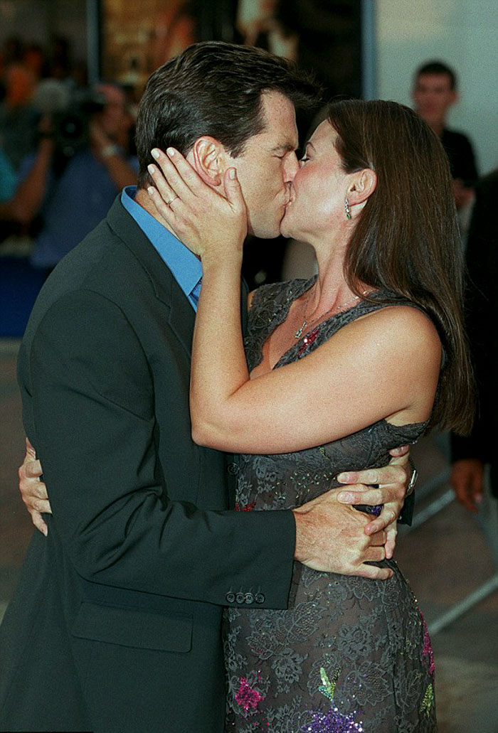 Pierce Brosnan Kissing his wife