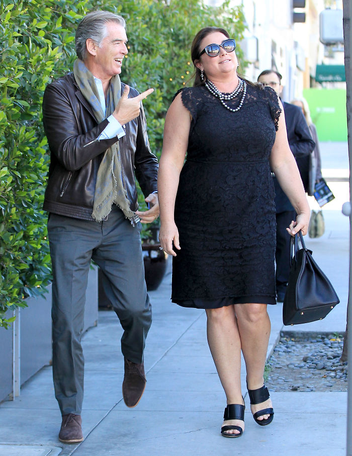Pierce Brosnan Walking Together With His Wife