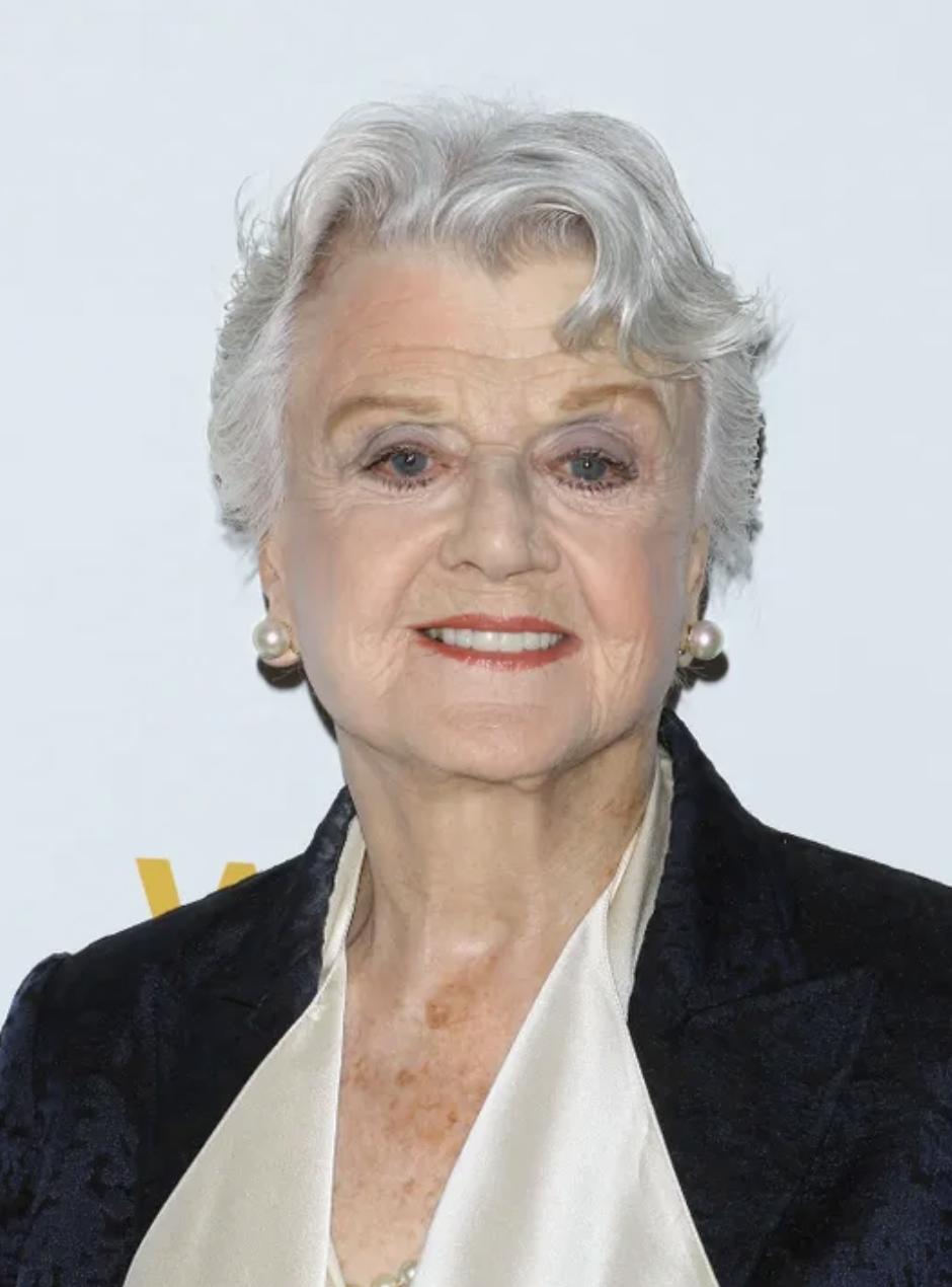 An older Angela Lansbury smiling on a red carpet