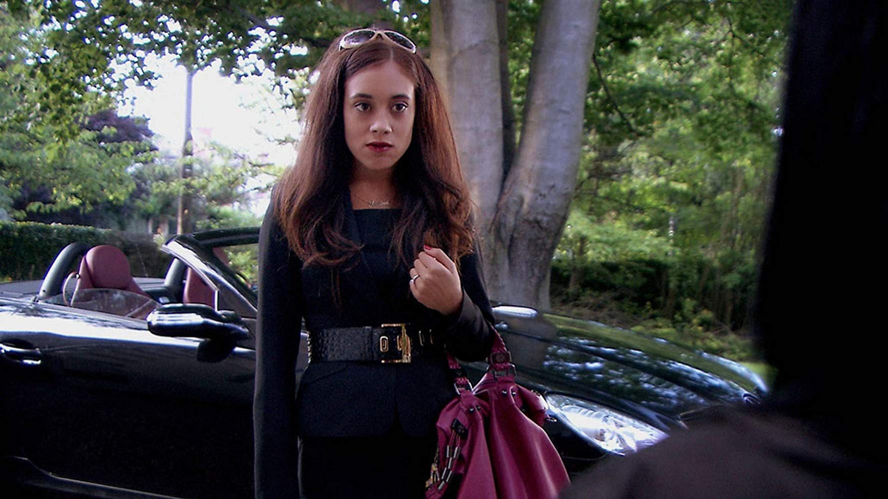 Tracy Beaker Returns Montanna wears a black dress