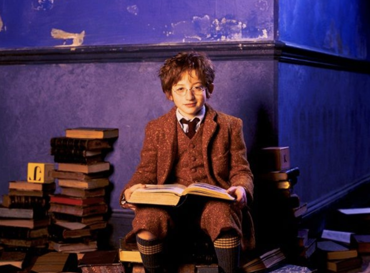 Nanny McPhee - Eric Brown surrounded by books, reading