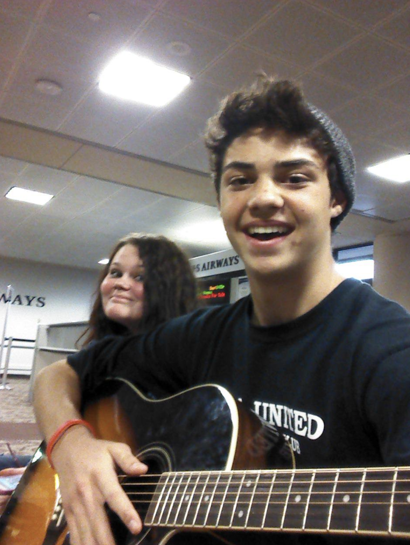 noah centineo playing guitar