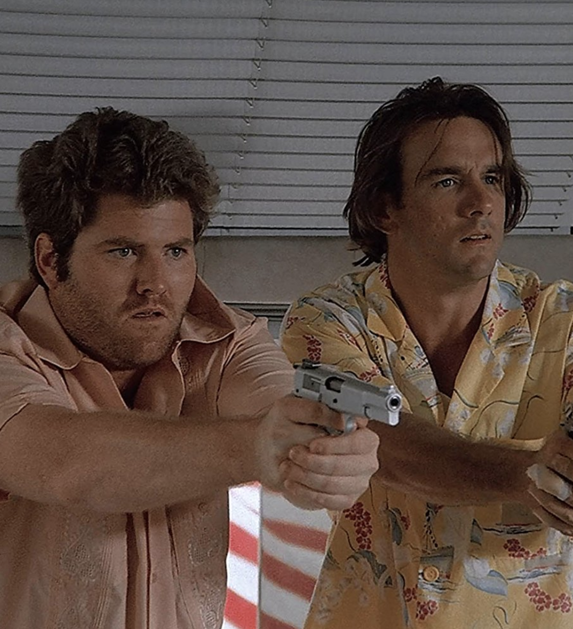 Miami Vice's Stan with a work partner holding guns