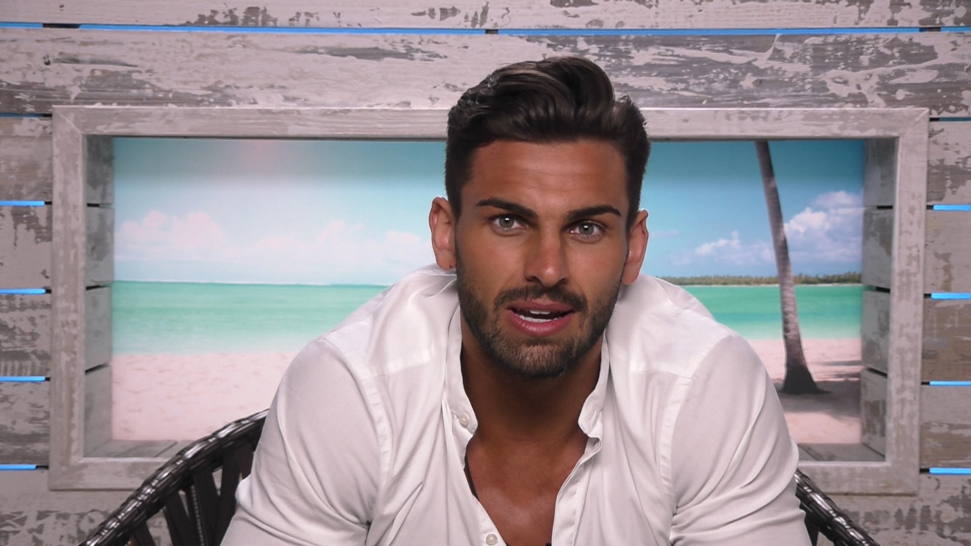 Adam Collard Love Island - in the villa's interview room