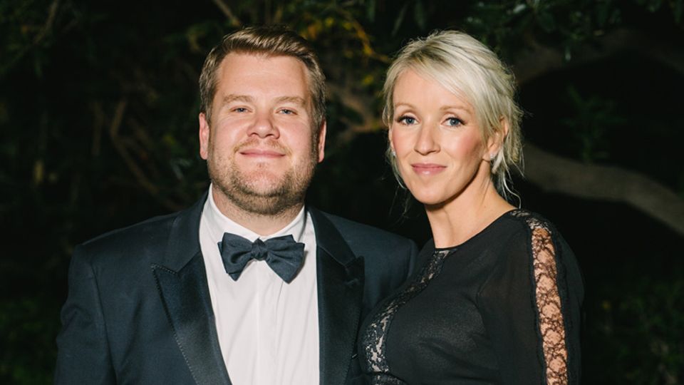 Talk show host James Corden and wife Julia pose