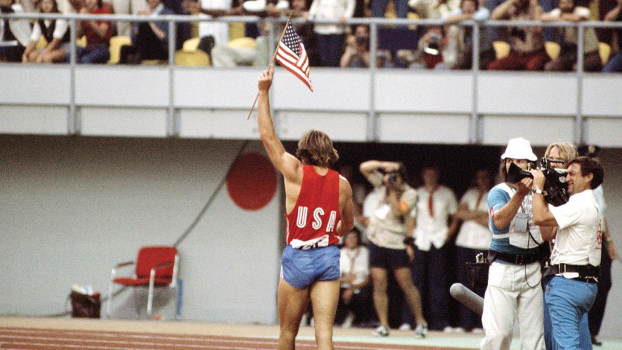 Jenner carrying US flag 