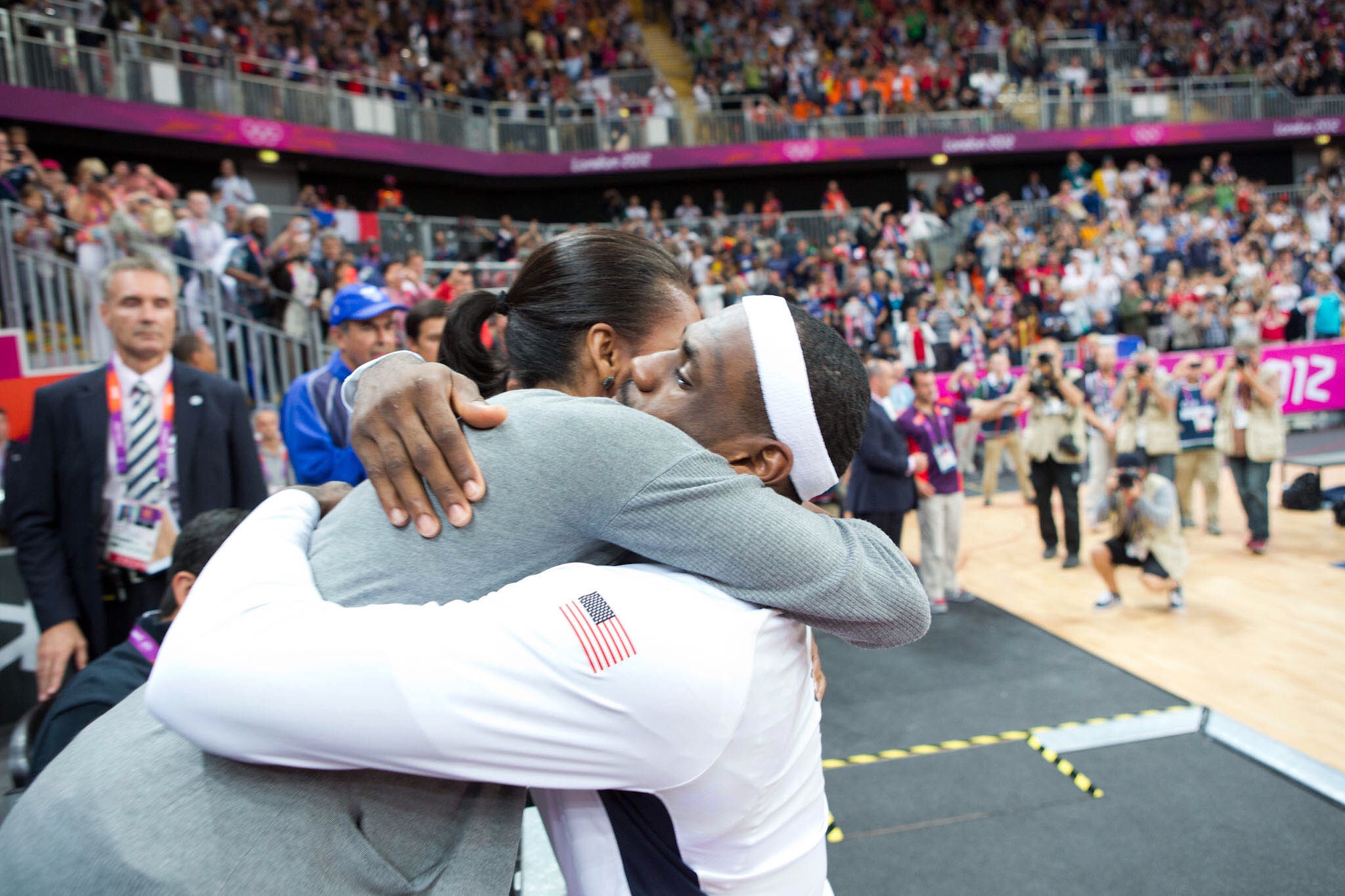 LeBron James and former US first lady Michelle Obama embrace after he put the finishing touches on his second gold medal at London 2012