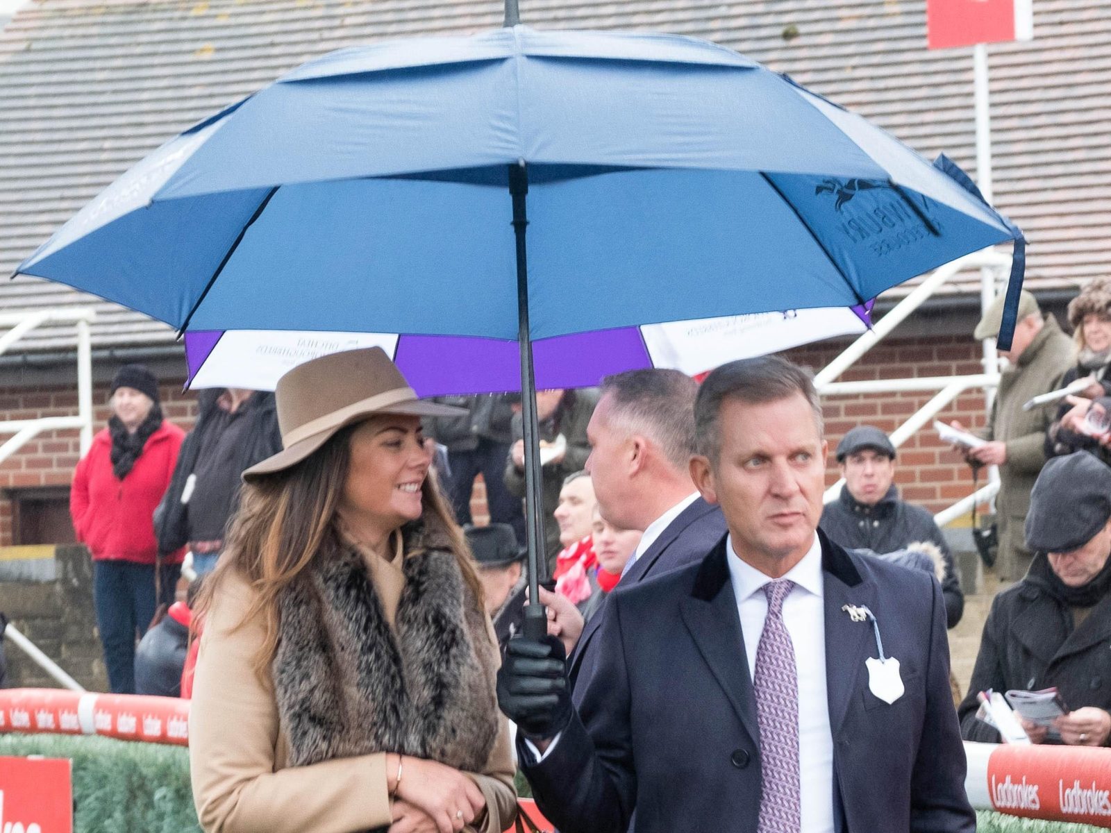 Chat show host Jeremy Kyle walking alongside fiancé Vicky Burton