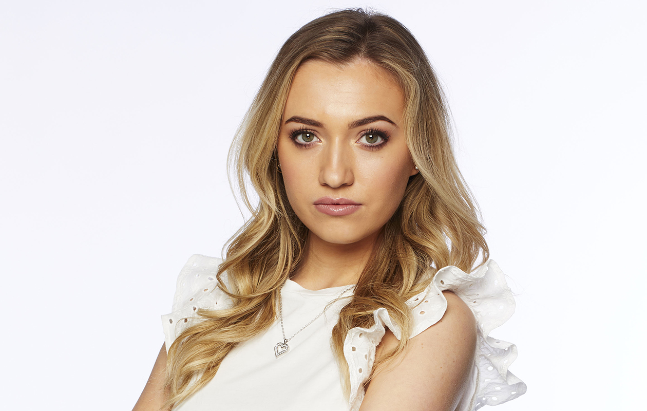Tilly Keeper posing for a professional photo