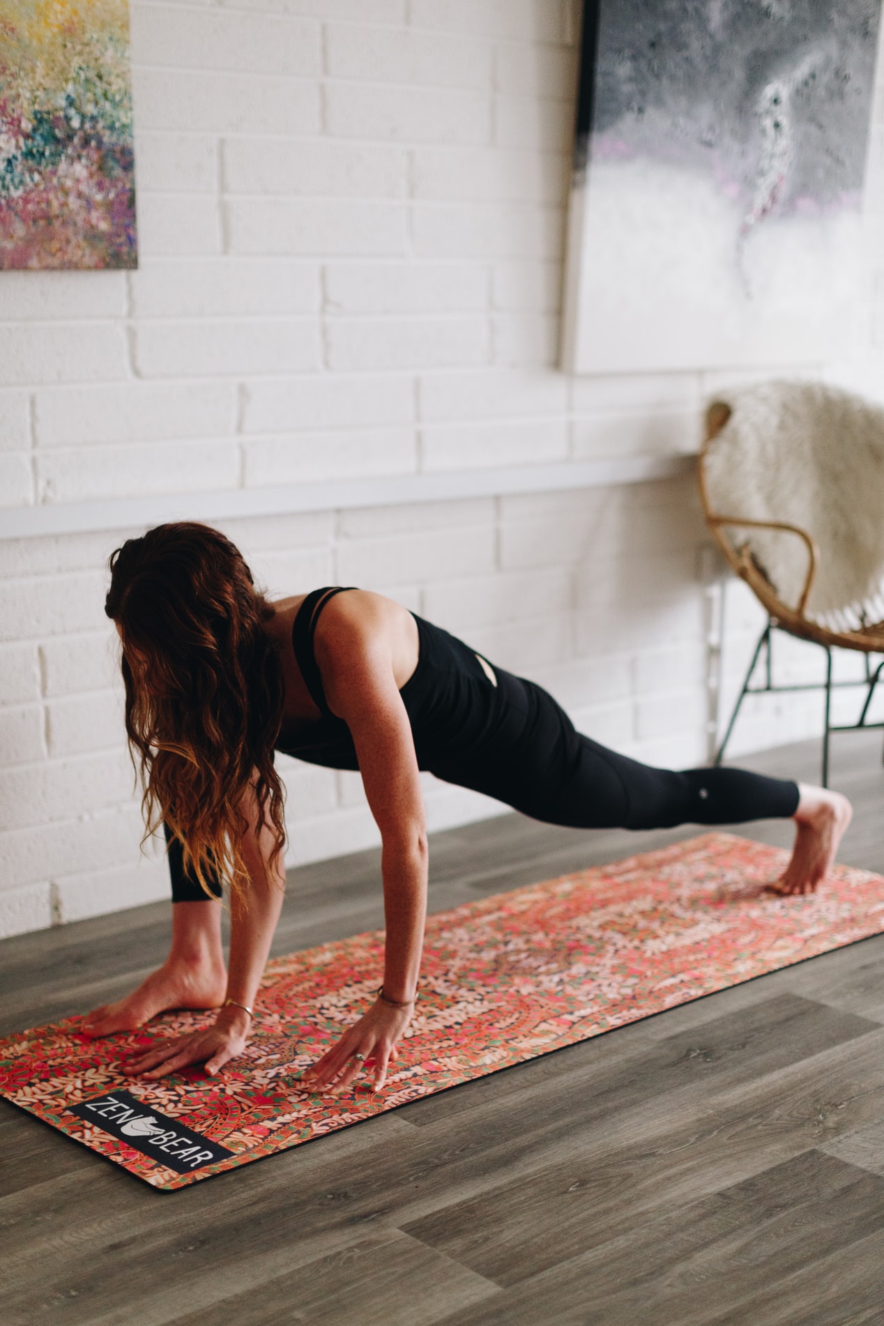 woman stretching on yoga mat