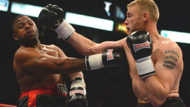 Freddie Flintoff and Richard Dawson in boxing ring. 