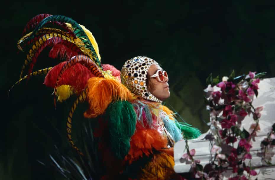 Elton John net worth Elton John performing in one of his iconic outfits