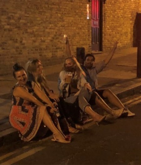 Adele enjoying pints with her friends in London.