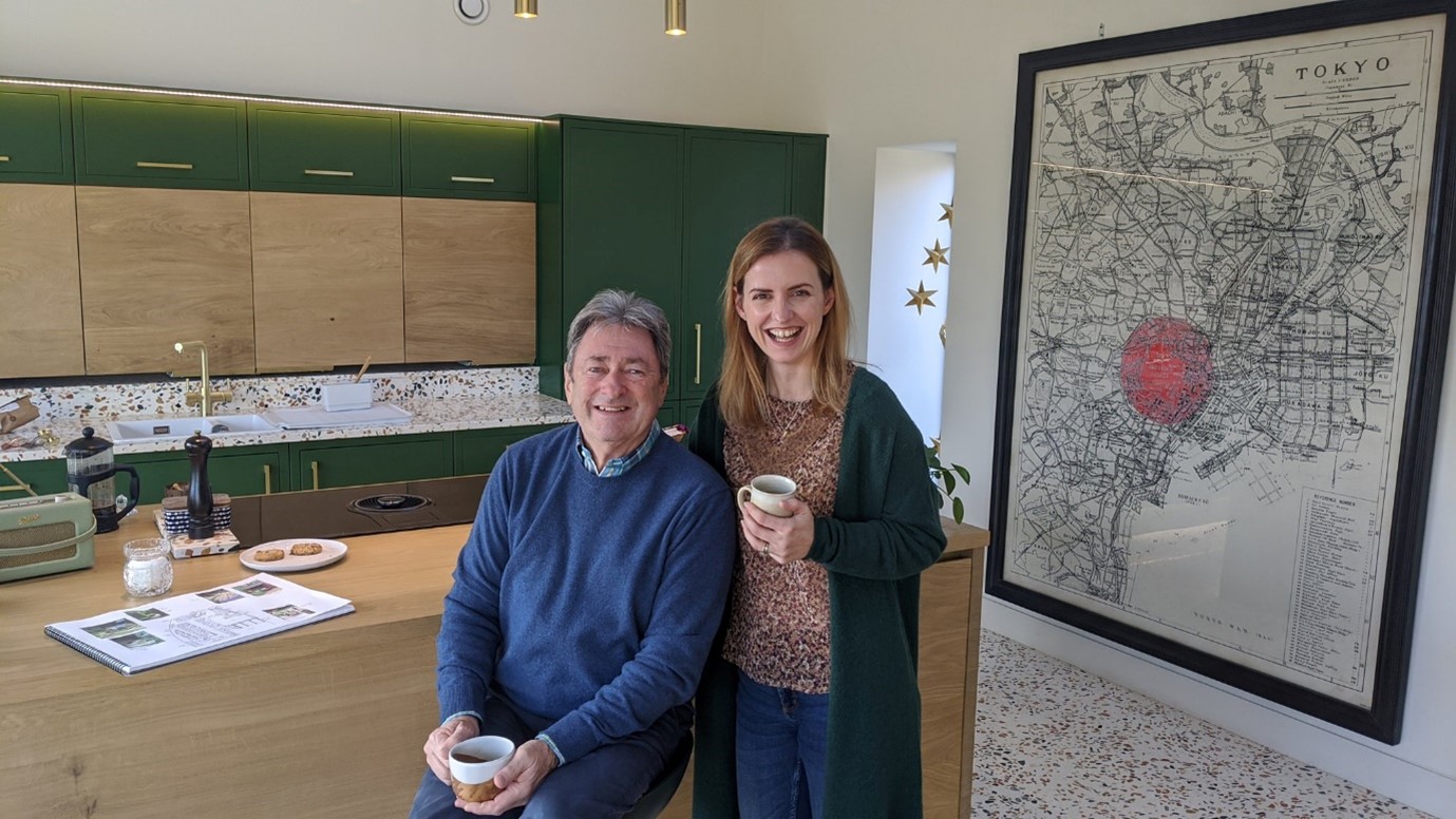 Katie enjoying tea and biscuits with Alan Titchmarsh.