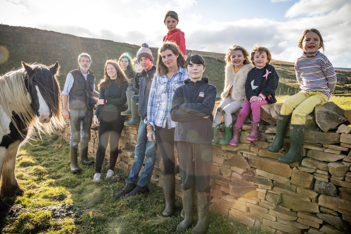 The farmer with husband Clive and their nine children.