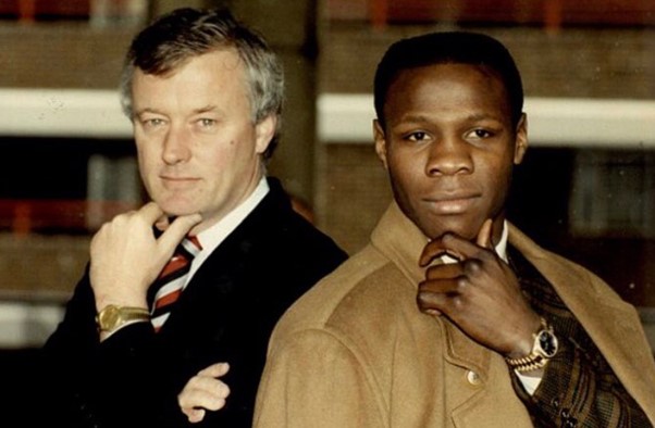 The business tycoon with boxer Chris Eubank in the 1980s.