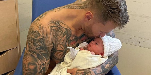 The reality star gets to know his new baby boy Crew Jax Christie.