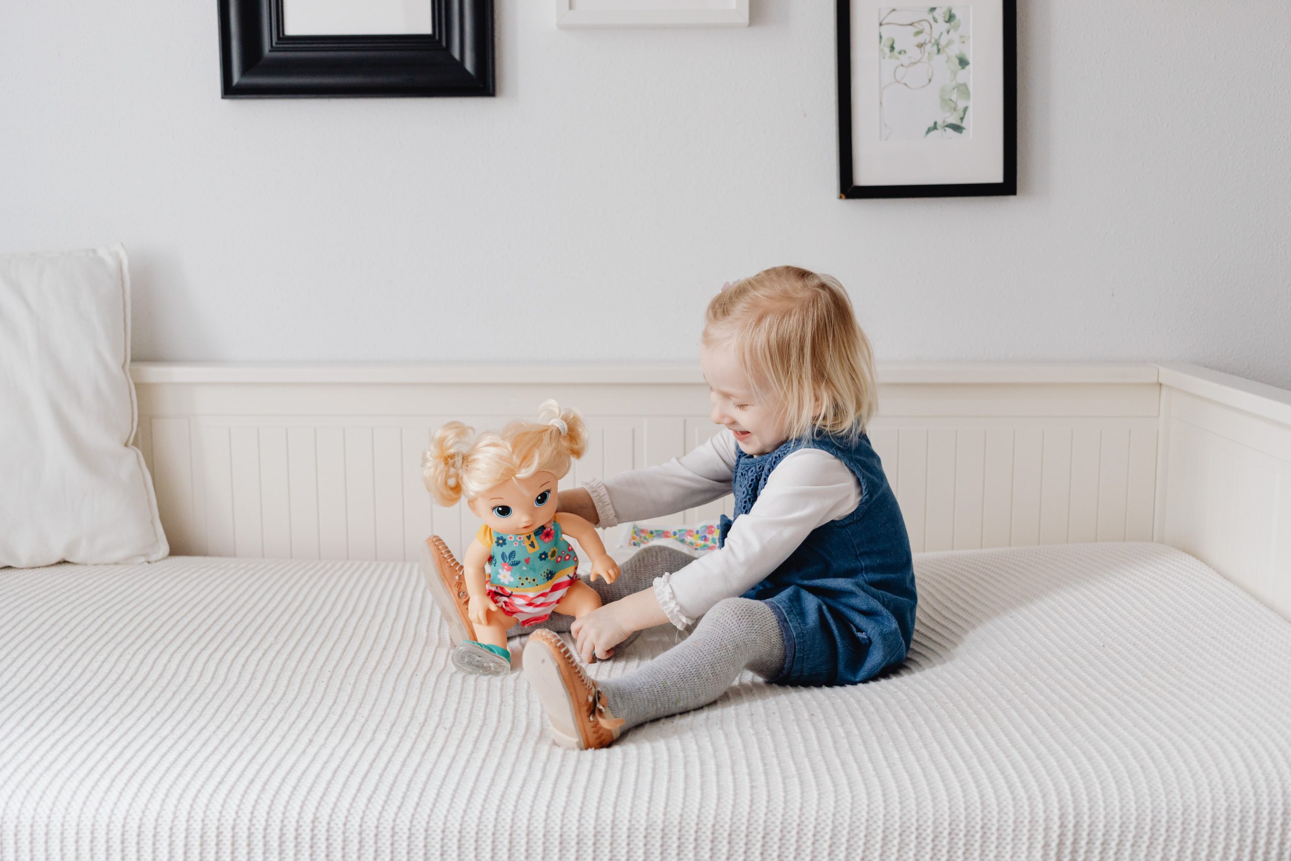 Girl Playing with Dolls