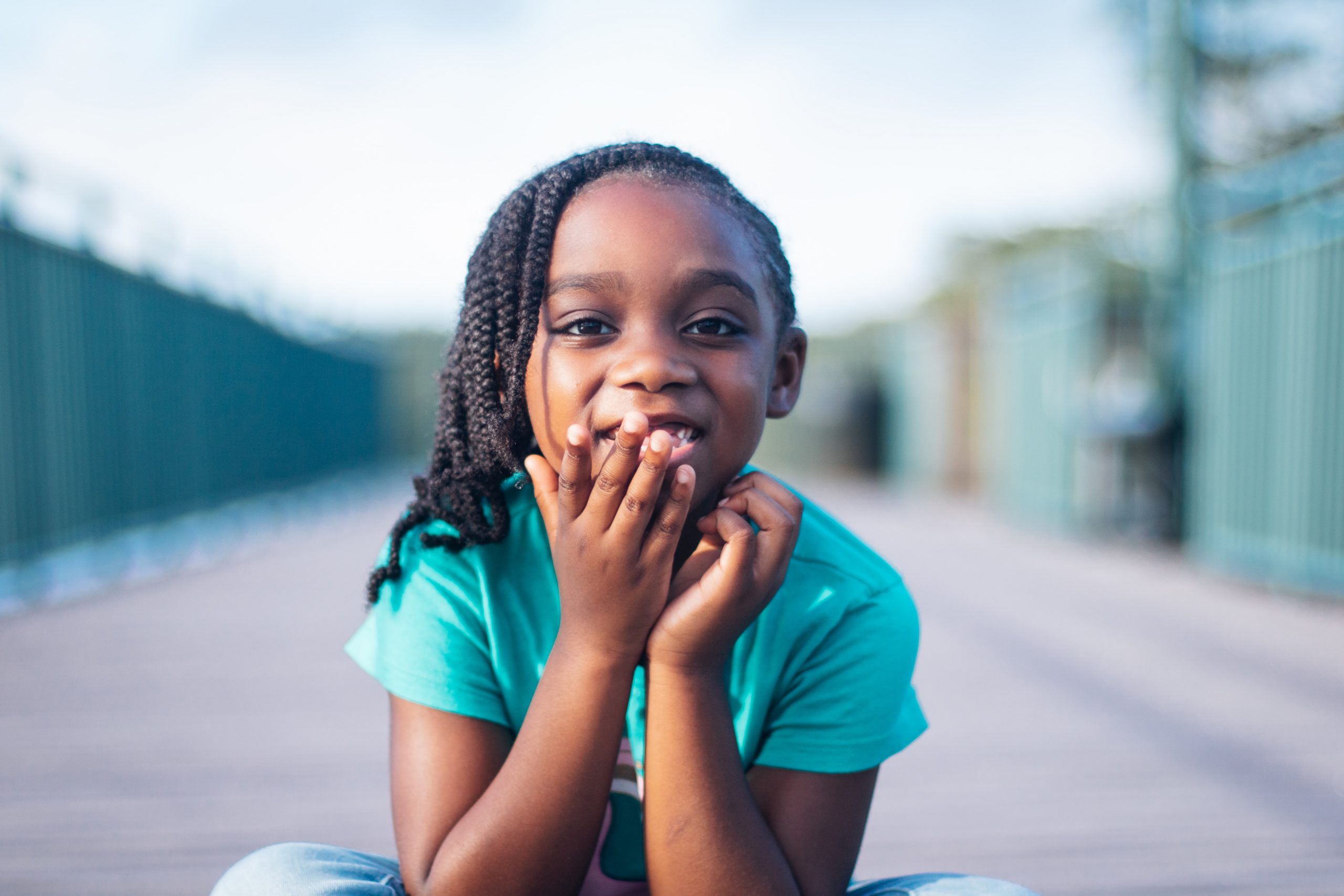 Girl Sitting on Ground