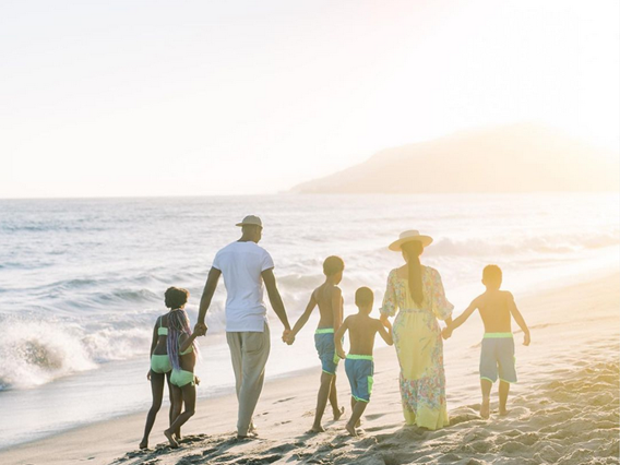 Chris and Adrienne Bosh enjoying a day at the beach with their kids.