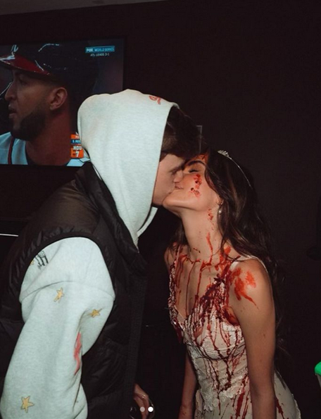 Madison Beer and Nick Austin get cosy at Halloween.