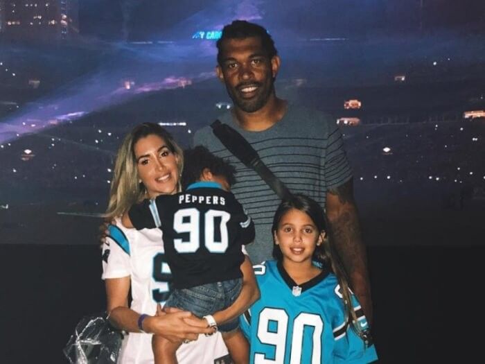 The model with her boyfriend, American Football star Julius Peppers.