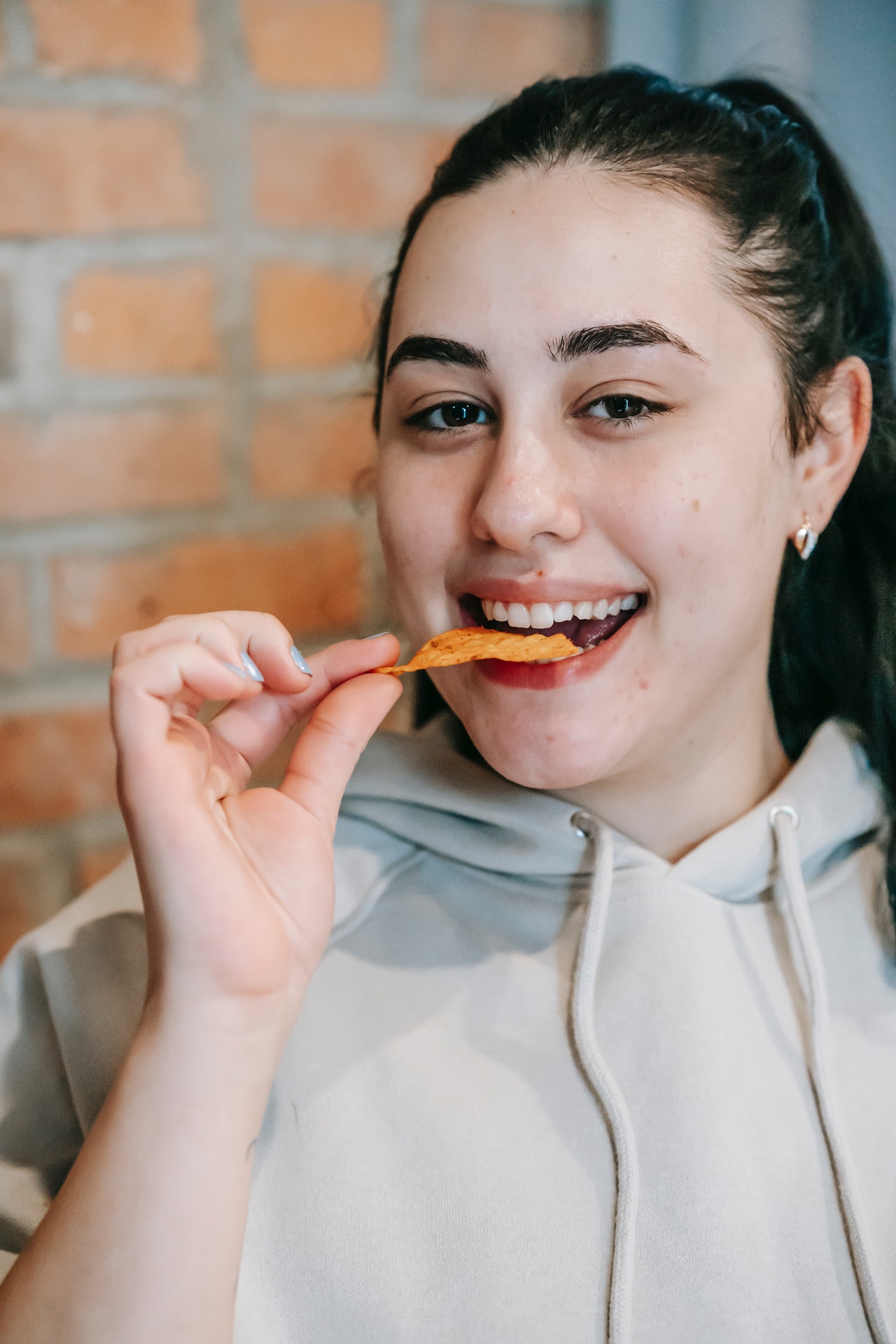 Woman Eating Crisps