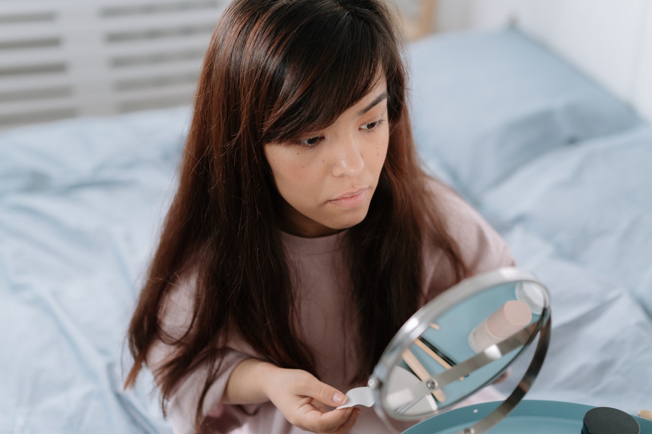 Woman Looking in Mirror