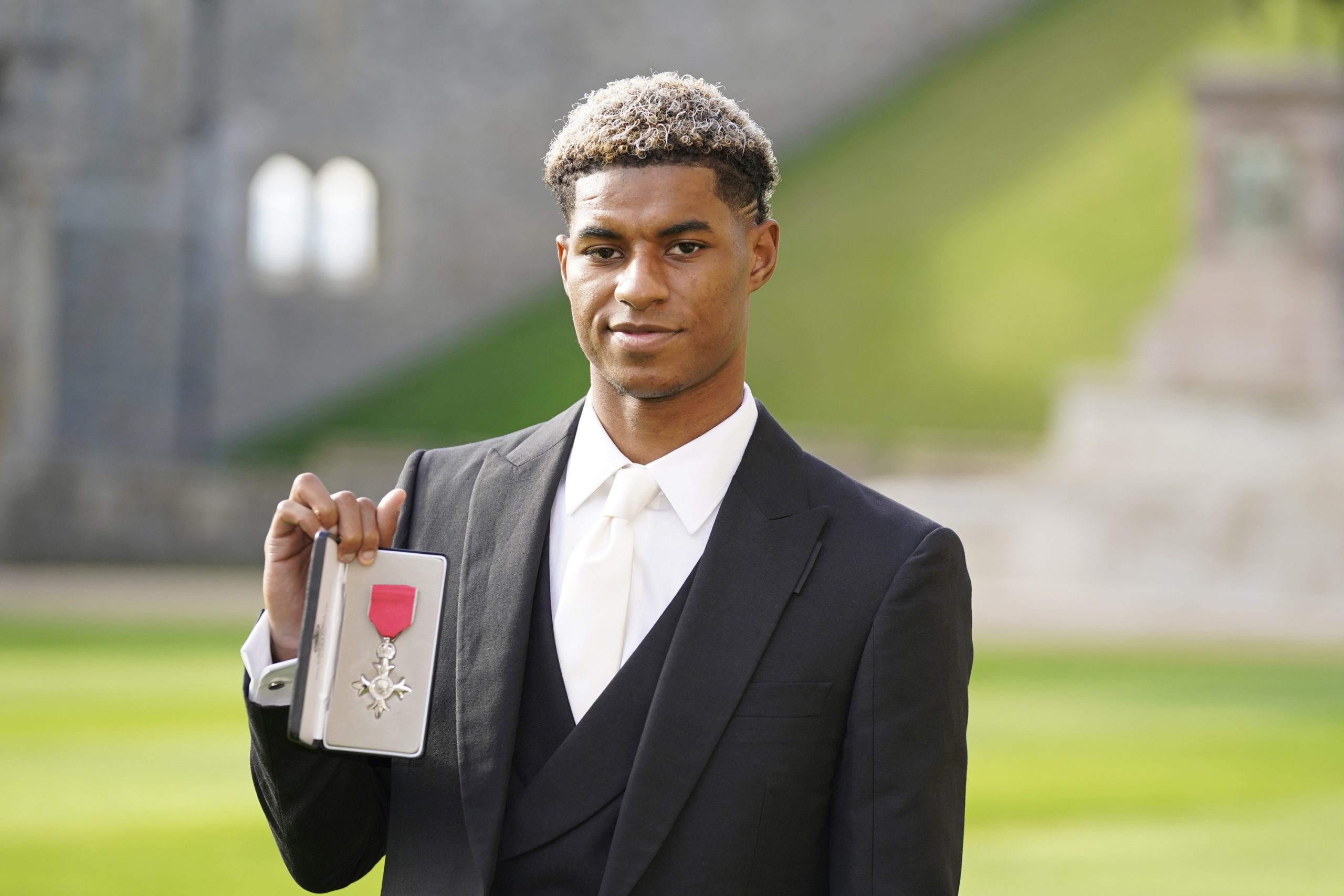 Marcus Rashford was honored with an MBE for his contributions to supporting vulnerable children in the UK during the Covid-19 pandemic.