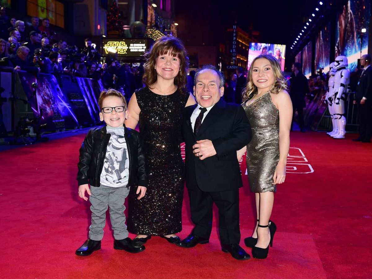 Warwick Davis and wife Samantha, with their two children. 